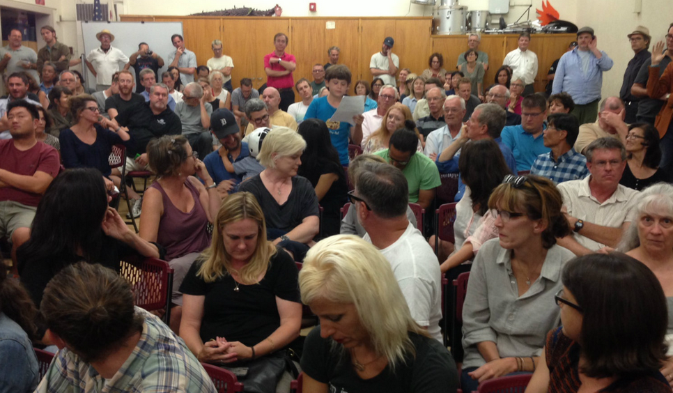 Matlock Grossman (center in blue shirt) reads his comments at the Rowena Avenue forum. Photo: Joe Linton