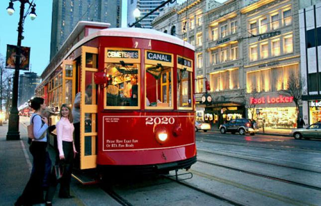 This ad from Louisiana Travel emphasizes trolleys as a "fun way to get around" for these white-presenting tourists — rather than effective way for a low-income rider to make it to work on time.